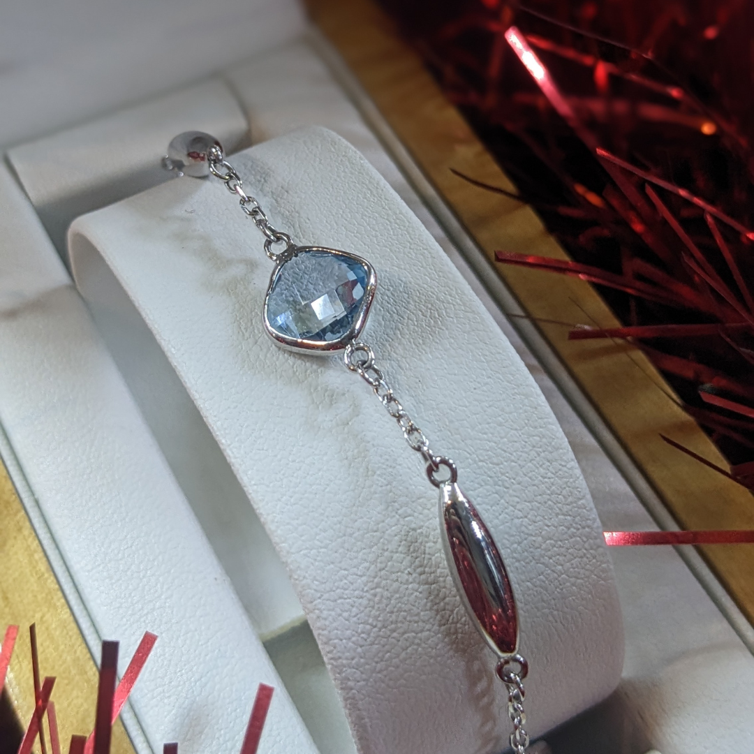 Blue Topaz Cushion Bracelet in 9ct white gold, Design Centre Jewellery. Jewellery Quarter Birmingham.